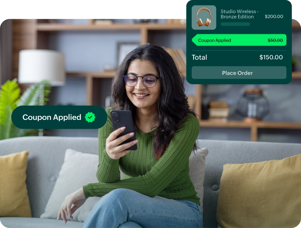 A dashboard view showing a woman on her screen, smiling as she sees a confirmation message that her coupon has been successfully applied.