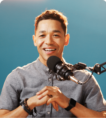 Creator speaking into a podcast microphone