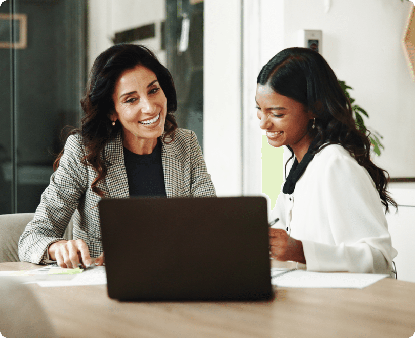 Two colleagues working together on a laptop