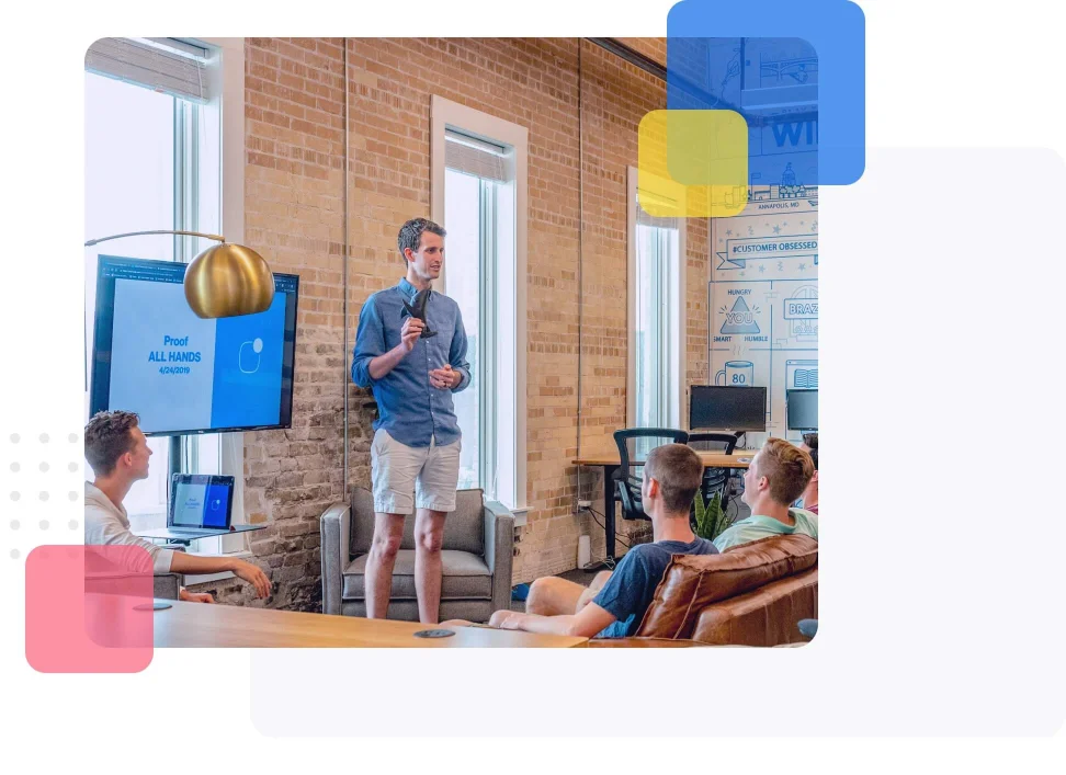 A presenter presenting to team mates